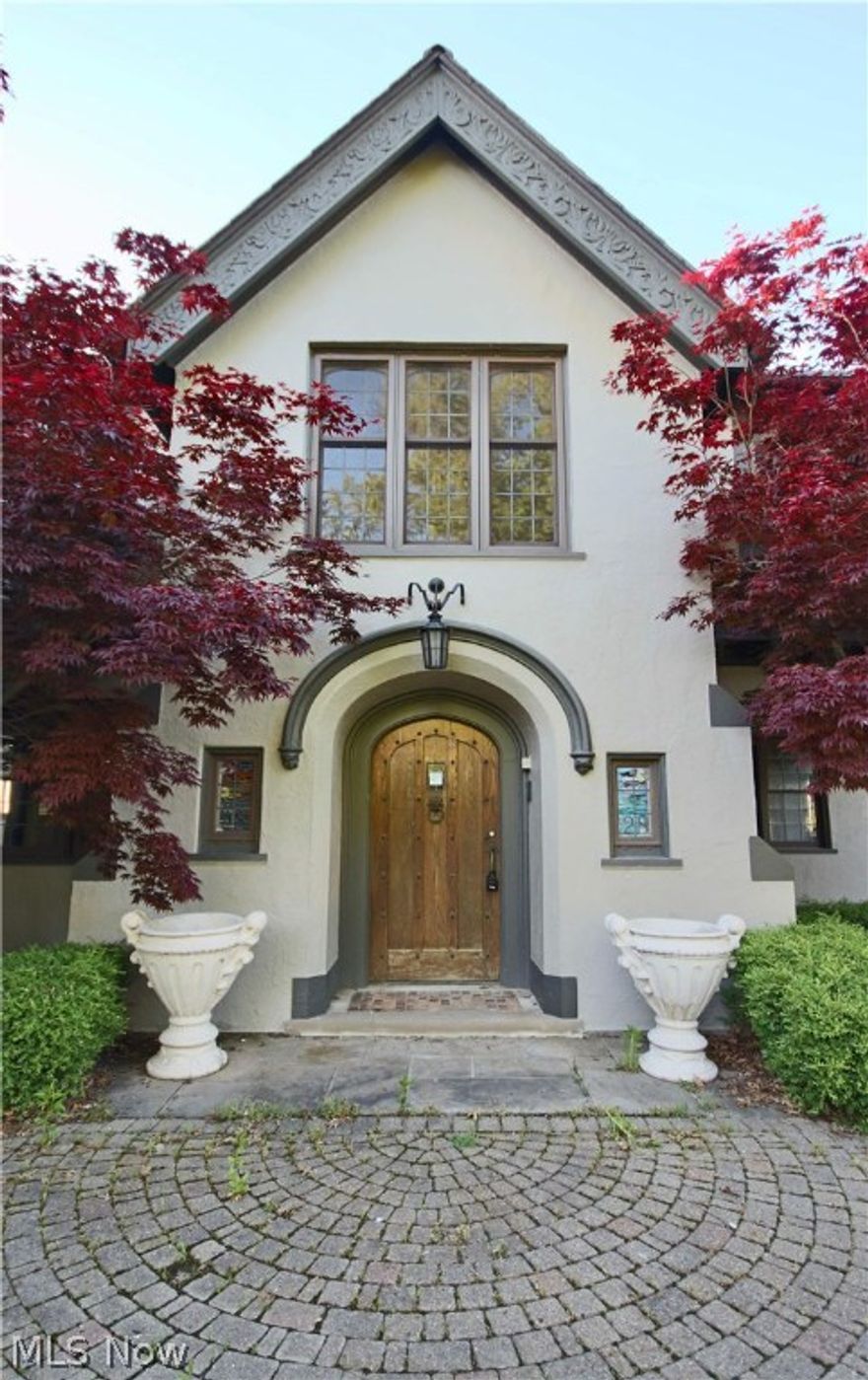 Spectacular 10,000 square foot, 14 room, six bedroom home on a beautiful 1.5 acre lake front lot . Natural Gas Well along with Mineral Rights included. Exquisite detail with hand carved wood, imported tile, lead glass, hidden doors, and more! Gracious and truly grand English Cotswold Tudor reminiscent of a Country Manor. Large rooms. Two attached garages with 8 cars total. In the ground pool surrounded by a patio for entertaining. All this and a Lake Erie lake front property. Being sold "As is". Proof of funds required with all offers.