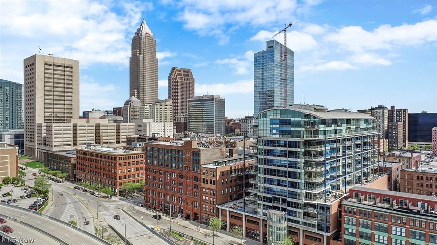 The only place like it in Cleveland. Enjoy all the best that living in the city has to offer. From right in the heart of downtown's most vibrant neighborhood enjoy the gorgeous lake views you expect at the Pinnacle - and also a 1,000' outdoor living space directly overlooking Cleveland Harbor! The Stadium and the Gold Coast frame the view. And there's a larger terrace than at most lakefront houses. Wrapping the whole NW corner, it's one of Pinnacle's most beautifully finished three-bedroom units. A gracious foyer welcomes you with an immediate view of the water. The open floor plan begins with a large living room area, then a spacious kitchen with a big island that's as great for cooking as it is for a party or for everyday comfortable living. The dining area looks right across the western shoreline and at the Stadium. Beautiful oak flooring throughout, and elegant stone surfaces. The master bedroom overlooks the water and has a dressing-room style walk-in closet and a white marble bathroom with a double shower and jetted pedestal tub. The guest room has a quiet spot right in the middle of the unit, with its own full bath. And the den/family room/2nd bedroom has a whole wall of windows and another full bath and walk-in closet. The enormous terrace, arguably the downtown's nicest, has room for multiple furniture groupings, and gorgeous potted landscaping. It's the definitive entertaining space in the Warehouse District. When you're not dining in or having a party, enjoy all the restaurants, bars and clubs right outside the door or a few blocks away in the East Bank - as well as right across the bridge in Hingetown or Ohio City. And thoroughly enjoy the easy walk over to football games, baseball all summer. And make the most of everything Playhouse Square has to offer. Picture perfect views of sailboats, freighters and dazzling sunsets from every window. Full Pinnacle amenities, and 2 deeded parking spaces.