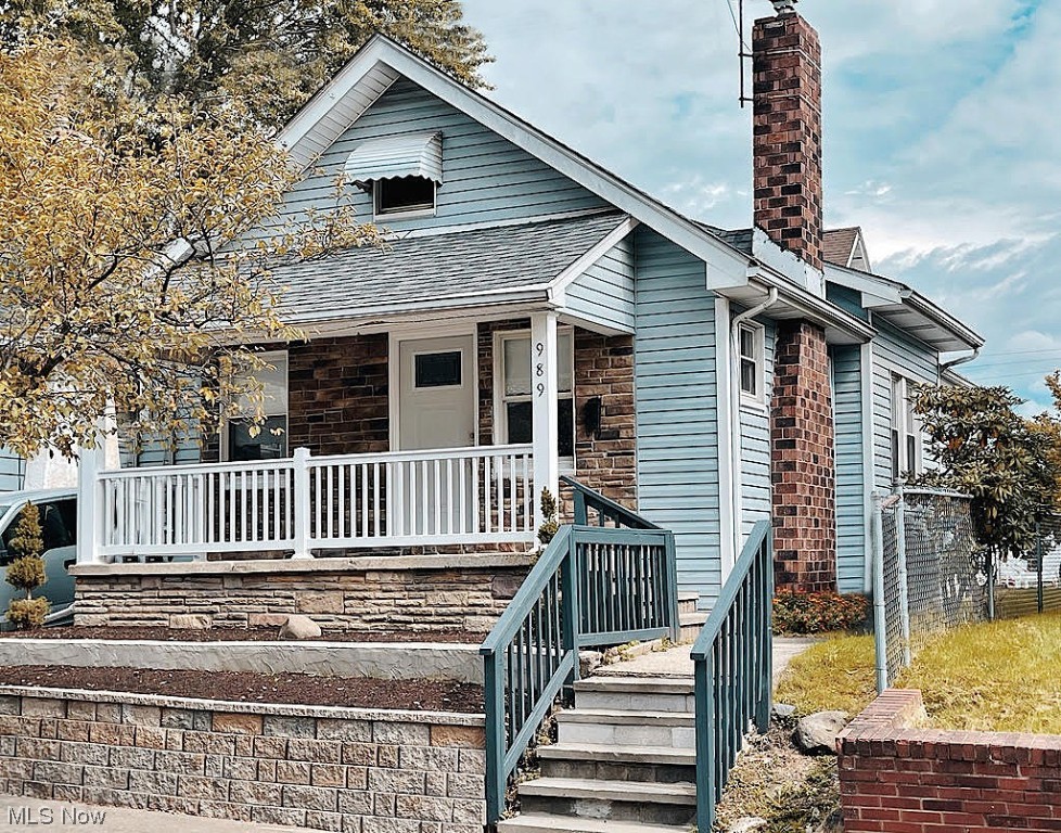 You'll love this delightful, newly-renovated bungalow in one of North Hill's classic neighborhoods. If you like front porches, this 16 ft. porch sets a warm inviting tone the moment you arrive. The spacious living room opens to the dining room, which will be easy to serve from the light, bright kitchen that's been refreshed with a new sink, tile backsplash, paint, new appliances (including gas stove) and flooring. In fact, there's new flooring throughout the whole main level. You'll appreciate the convenience of having two bedrooms on the main floor, and if you need more room, the 30 ft. bedroom/bonus room upstairs will be great! There's ample room for beds, other furniture and more. The remodeled bathroom includes new fixtures, vanity and a large alcove shower stall with a sharp new surround. The unfinished basement is ready for your touches, and if you like to garden there are numerous planting beds for you to fill. There are two, lovely planting beds in the front, a big garden space in the back yard, and two additional planting spaces along the back of the house. The location is great, too. It's close to schools, all kinds of restaurants and it's close to Rte. 8 for easy access to Canton or Cleveland. Don't let this one get away!