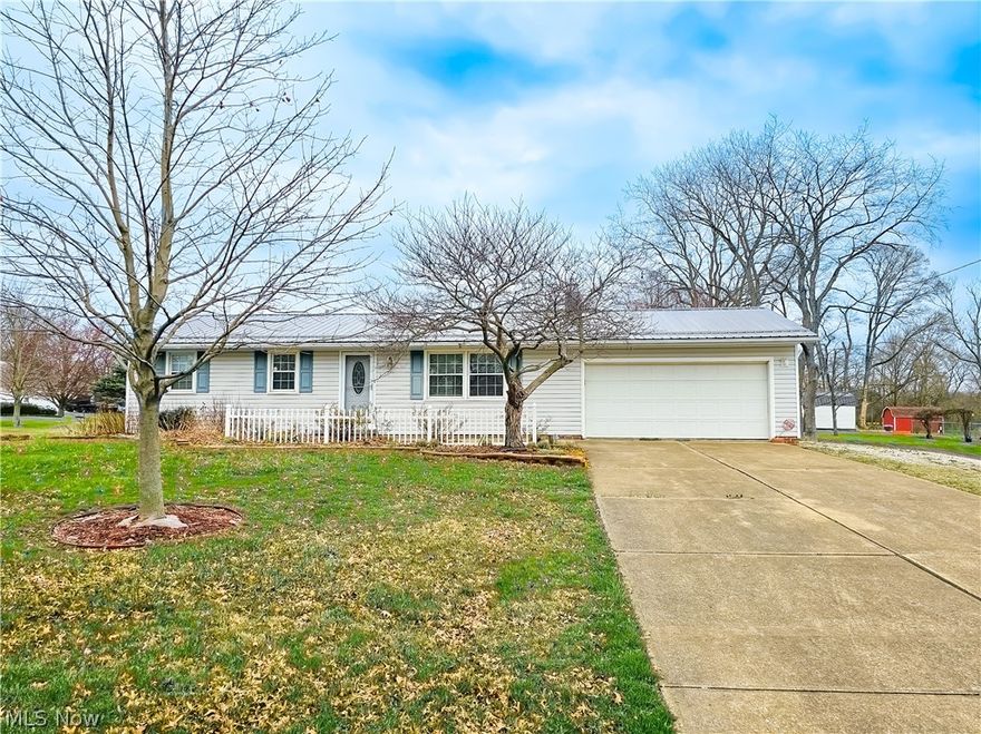 Welcome to your cozy ranch home situated on .69 acres in the desirable Tuslaw School district / Tuscarawas Twp area. This 1,161 sq ft  home offers 3 bedrooms and 1 full bath with a shower in the basement and 2 car oversized attached garage with man door. Inside you will find a bright and spacious updated white kitchen with eating area, clean white cabinets, quartz counters, newer stainless appliances, reverse osmosis filtration system and tile floor. Adjacent to the kitchen is a nice size living room having hardwood floors, and plenty of natural light from the large windows. There are 3 bedrooms with adequate closet space and hardwood floors. An updated full bath with double quartz vanity, jacuzzi bath tub, and tile floor provides convenience on one level. The basement is partially finished, laundry area, wood burning stove, cedar storage room, waterproofing system (Ohio State Waterproofing- transferable warranty) glass block windows, 100 amp electric, sump pump, and plenty of storage space. Venture outdoors to your own private retreat, complete with spacious deck and above ground pool with heater, newer liner and pump, and adjoining swim deck- It’s the perfect setting for outdoor gatherings or simply enjoying some relaxation. At the rear of the property are two sheds – 10×16 and 14 x 20 (with electric) that offer ample storage space. Home also offers newer stainless roof, well pump & pressure tank 2019, security system, Rheem furnace and air conditioning 2014, hot water heater 2011, vinyl replacement windows, and generator ready with manual switch. Taxes $1024.89 per half. Tuslaw school district, Stark Co. parcel #7202325 . Solid home in a wonderful location!! You must see all this property has to offer!! **Estate Auction Wed May 8th @ 5:30pm**Open auction day at 4pm. Come bid, buy, and enjoy your summer staying cool in the pool!