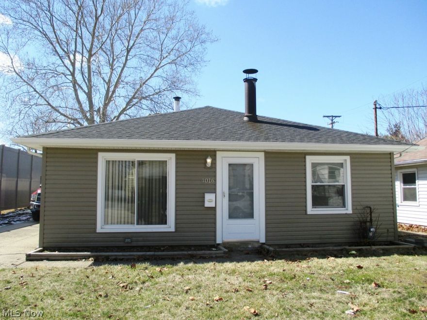 Cute doll house has been completely rehabbed! Major updates include new roof on house and garage, new siding and doors, new windows, and new overhead garage doors. Brand new KraftMaid kitchen cabinets with ceramic tile floor and backsplash plus new sink and faucet. New electrical including new light fixtures, switches and outlets. Newly carpeted and freshly painted. Move right in! Low down payment, FHA and VA.