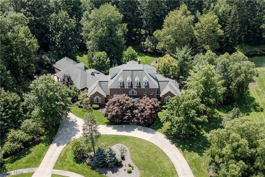 Rarely does an opportunity arise to acquire a turnkey estate of this caliber in one of Northeast Ohio’s most coveted enclaves. Set on more than five acres along Chairmans Rowe, Westlake’s most distinguished street, this Valore-built estate balances enduring character with modern refinement. Recent renovations enhance the home’s original craftsmanship while promoting a contemporary lifestyle through Savant and Lutron systems and modern appliances. The main level is thoughtfully designed with a renovated kitchen opening to a sunroom overlooking the grounds, complemented by both casual and formal dining areas, a private office, and a serene primary suite with a spa-like bath and generous dressing room. The second and third finished upper levels provide five additional bedrooms, including a guest suite, and three full baths. The walkout lower level offers a natural setting for gathering, complete with a theatre, game room, full bar, wine cellar, and direct patio access. A heated garage, steam shower, backup generator, and other well-considered details ensure comfort in every season.