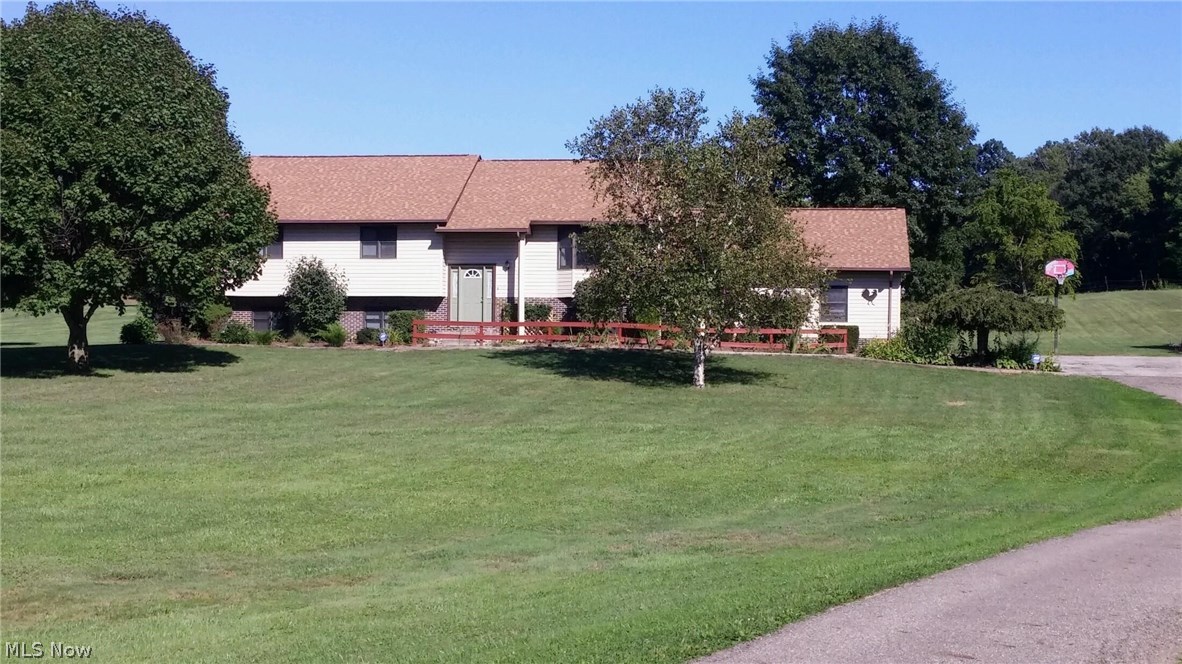 Rare opportunity! 2.41 acres with 3064 sq. ft. home. 5 bedrooms, 3 full baths. Very open and spacious. If you're looking for the one, this is it! Nice bedrooms, two with walk-in closets; three up and two down. Main floor has open great room to the kitchen, dining and family area with cathedral ceiling. Beautiful cabinetry, nicely laid out to entertain. Master bedroom has its own master bath and walk-in closet. Lower level has a huge family room with full bath, laundry room, office and two bedrooms. Paved driveway with 25 x 25 over sized garage and a barn shed in the rear. To much to mention here! This is your forever home! Call before it's gone!