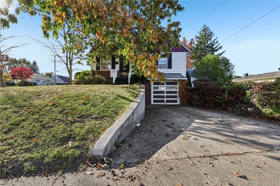 Don't miss this rare opportunity for a 4-bedroom, 2 full bath home, in the Coventry Neighborhood of Akron. Featuring two generously sized bedrooms and a full bath on each floor, it is perfect for those seeking the ease and convenience of one-floor living. Enjoy ample space in this inviting home featuring a large living room perfect for relaxing or entertaining and a lower-level recreation room, ideal for family fun, hobbies, or a cozy movie night. A few of the many updates of this home include: In 2023; new electric box, kitchen backsplash and flooring, walk-in shower installed in first-floor bathroom, and new flooring in the upstairs hallway and bedroom. In 2024; a new stove was installed, a new garage door motor, keyless entry to the back door, a new hot water tank, and the plumbing was updated and pipes jetted. In October 2025; carpeting was installed in the recreation room, a new kitchen refrigerator, and a vanity, light fixtures and a medicine cabinet were replaced in the first-floor bathroom. Step through the decorative arbor into this beautiful backyard, featuring mature trees, lush grapevines, and privacy shrubs. There's plenty of space for outdoor entertaining, gardening, or simply relaxing in the fresh air. A large storage shed with electricity provides the perfect spot for hobbies, projects, or extra storage. Situated on a corner lot, this home includes a driveway and garage on Cory plus an additional driveway off Flanders, ideal for extra parking or easy access. This home offers the perfect combination of comfort, convenience, and charm. Schedule your showing today!