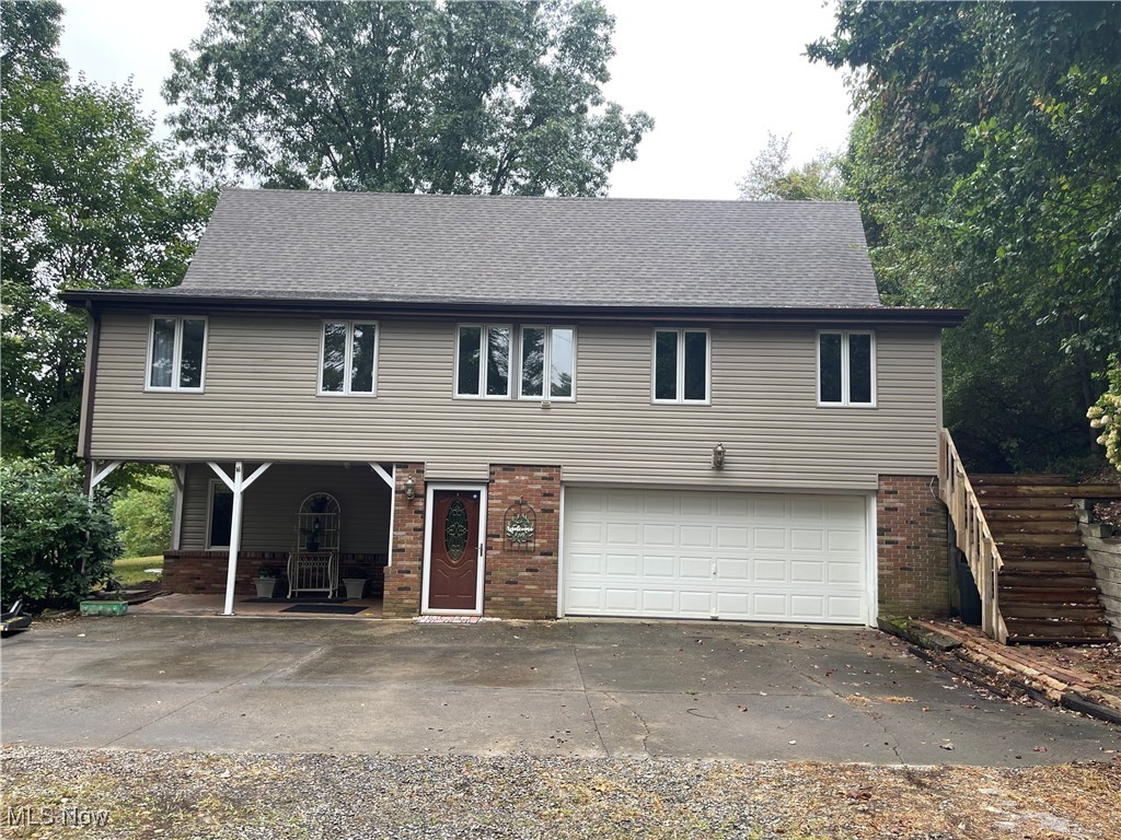 First time offered! Embrace the serenity of country living in this secluded home, but only one mile from Interstate 77. 12.75 acres including the mineral rights that seller owns will transfer to the new buyer, and free gas to the home as long as its available. The property offers mostly wooded land, but also cleared land for pasture and a flat yard. Abundant wildlife and trails for the nature lover. 4 BR's, 3 Bths, The great room has a ceiling that is 22 ft at it's peak, large stone fireplace, and huge windows. The dining room is open to the great room. FAMILY ROOM: All the beams on the ceiling are from a barn between the two houses south of the home. The mantel in the family room came from a tree on the property. The arches were wagon wheels made by the owner's grandfather, the wood on the walls is from reclaimed wood from an old barn. The water marks on the reclaimed wood over the stone fireplace is the way the wood came off the barn. Woodburning stove. Solid Surface kitchen counters, small pond with goldfish, 20X30 pole barn with a metal roof, water is available but there is a leak in the line. There is an electric fence around the pasture. The fence needs some repair and the electric is off to the fence. There are pine trees, some poplar, oak, and maple trees. Most of the property behind the home is wooded. It does flatten out on the top but the area that isn't wooded is the neighbor's property. The lane to the home is about 1/4 mile. It is not the first cabin to the left that is "For Sale" this property is further up the lane. It is a dead end. The seller's own the cabin but want to keep it at the present time. It is on 2.5 acres. The gas well that you see as you go up the lane to the right is not on the seller's property. Numerous updates include: New Flooring in entry way & family room next to the fireplace. Still Available. New Roof in 2021, furnace 2022, Microwave, dishwasher, refrigerator 2017, hot water heater 2018, New well 2017 Civello 135 ft.