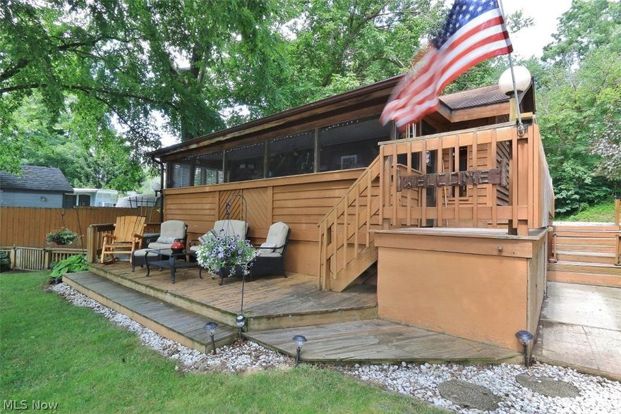 Beautiful River Front Retreat. This Cedar sided home offers 2 bedrooms with a loft area that could be for guests. 2 full baths. Nice eat in kitchen. Cozy living area. The full length screened in porch offers a wonderful place to have that morning coffee or relax with a book. Step out onto the expansive decks with plenty of room to entertain. If it rains on your party do not worry because there is an enclosed patio where everyone can gather. The newer 40ft boat dock has plenty of room for a couple boats. This is a great 3 season home. Do not miss out on having a little place to relax and enjoy life.