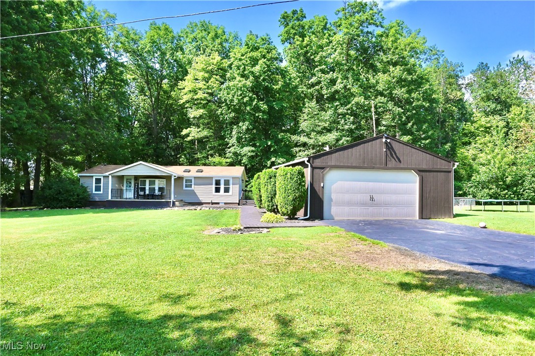 **Charming Country Retreat at 3982 Pritchard Ohltown Rd**
Discover the perfect blend of comfort and tranquility in this delightful 3-bedroom, 2-bathroom home, nestled on a fully fenced 1-acre lot along a serene country road. Just minutes from picturesque Lake Milton, this property offers a peaceful escape while remaining conveniently close to Jackson Milton and Newton Falls schools, with easy access to the school bus route.
As you enter, you're greeted by a spacious porch that invites relaxation and social gatherings. Inside, the home exudes warmth and character, highlighted by elegant shiplap ceilings throughout. The bright eat-in kitchen boasts stainless steel appliances and exquisite Kraftmaid cabinetry, creating an inviting space for culinary adventures. A sliding door with built-in blinds opens to a vast private yard, perfect for outdoor enjoyment.
The master bedroom is a true retreat, featuring a generous master bath for your convenience. Two additional well-sized bedrooms provide ample closet space, ensuring comfort for family and guests alike. The property is complemented by a large detached garage and a practical storage shed for all your tools and toys.
With its expansive front yard, tasteful landscaping, and thoughtful interior touches, this home embodies classic ranch-style living in a serene countryside setting. Recent upgrades include a brand new Kinetico water system, an updated septic system, and a newer well, ensuring peace of mind for years to come.
Pre-approval is required prior to showings. Don’t miss the opportunity to make this charming country retreat your own!