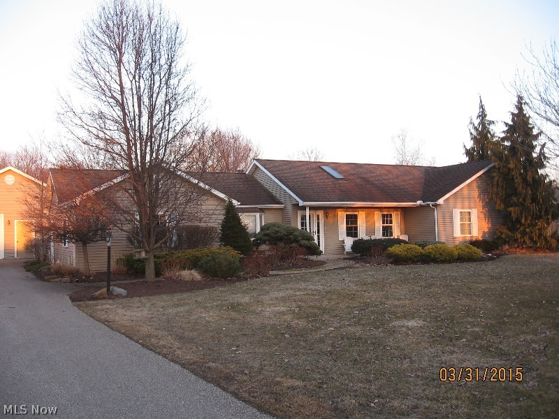 This sprawling ranch is perfect for the family who likes to entertain indoors & out. Large kitchen w/ plenty of oak cupboards, island, eat in area and open to the rec rm & huge living rm. The rec rm w/cathedral ceiling is currently set up as a pool rm & features a bar w/easy access to half bath. Living rm offers loads of natural light, wood stove & slider that leads to the outdoor living space. New carpet in living rm, hall & bdrms. Master bdrm features walk in closet plus 2 more closets & spacious bathrm w/closet. Large mud rm w/bench storage. The backyard is your own paradise, professionally landscaped w/paver patio, 2 sitting areas, above ground pool & relaxing hot tub! The 28x32 det. garage is heated w/workshop area. Paved drive & great curb appeal. Motivated seller says bring an offer!