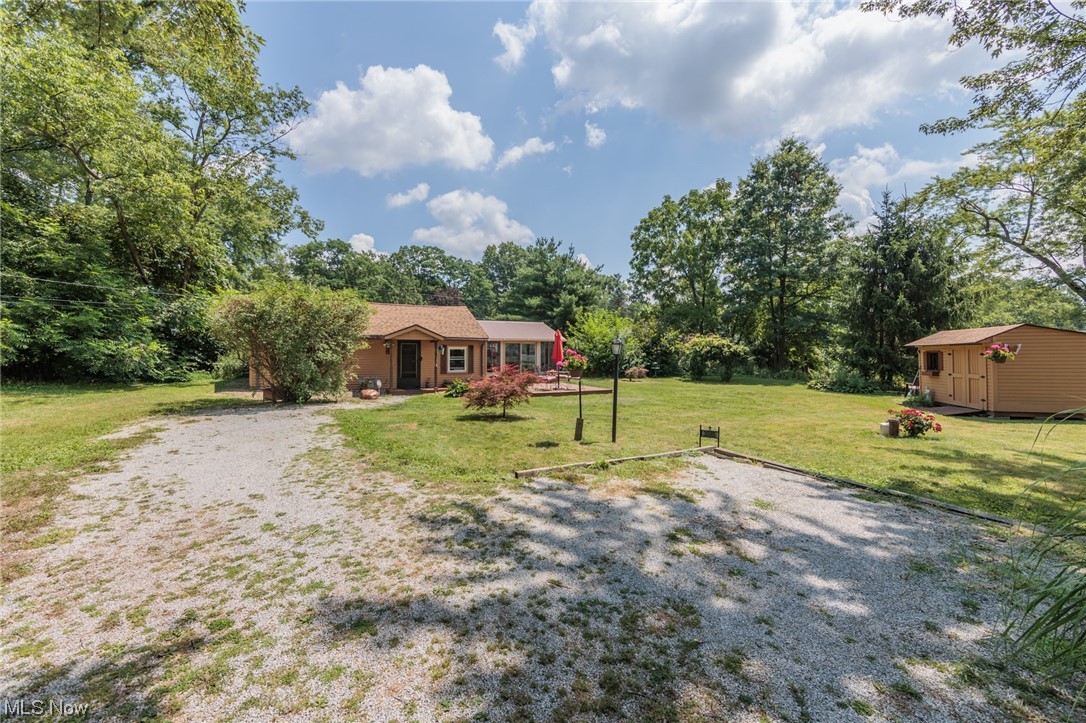 Welcome to this charming ranch home on a double lot (200x90) in Portage Lakes! Approaching this ranch-style home, you'll notice the inviting curb appeal. The 12x16 deck offers a cozy lovely spot to enjoy your morning coffee. Theupdated kitchen boasts modern appliances, with ample cabinet storage. Off the kitchen is the 14x16 sunroom, which is a great spot for an evening of relaxation and enjoy these summer nights. The spacious bedroom offers a peaceful retreat with large windows that allow natural light to shine in. Act fast and make this lovely ranch yours today! Updates: Water softener- 2019, Tankless Water tank- 2014, Roof-2018, Gutters- 2021, Well-2014, Well Pump- 2022, All appliances included: Stainless microwave, stove, refrigerator, washer & dryer unit, and Delongi portable room air conditioner