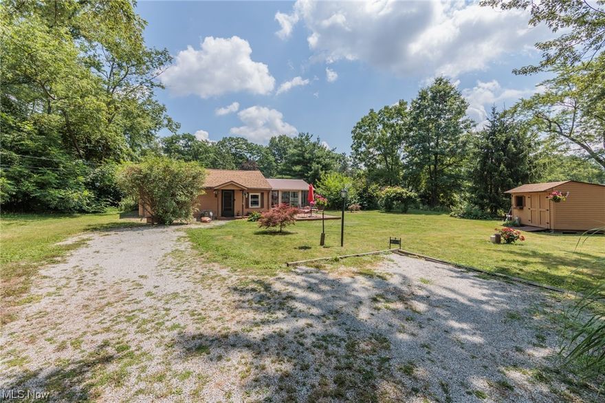 Welcome to this charming ranch home on a double lot (200x90) in Portage Lakes!  Approaching this ranch-style home, you'll notice the inviting curb appeal. The 12x16 deck offers a cozy lovely spot to enjoy your morning coffee. Theupdated kitchen boasts modern appliances, with ample cabinet storage. Off the kitchen is the 14x16 sunroom, which is a great spot for an evening of relaxation and enjoy these summer nights. The spacious bedroom offers a peaceful retreat with large windows that allow natural light to shine in. Act fast and make this lovely ranch yours today! Updates: Water softener- 2019,  Tankless Water tank- 2014, Roof-2018, Gutters- 2021,  Well-2014, Well Pump- 2022, All appliances included:  Stainless microwave, stove, refrigerator, washer & dryer unit, and Delongi portable room air conditioner