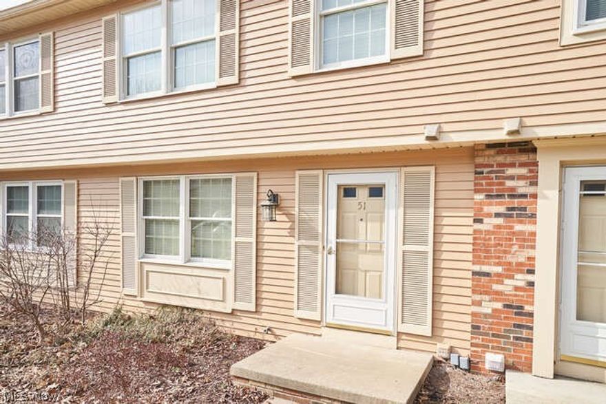 Wonderful 2 bedroom townhouse located in Copley Fairlawn Schools.  Kitchen has been updated with wall between  the kitchen and dining removed to open to wonderful modern space.  Newer white cabinet island and granite counter top with bar area has been added. Other cabinets have been painted white. Slider in the dining room area leads to deck. Hardwood floors  on entire first floor.  Guest bath located off the foyer has been updated with newer cabinet,counter top, faucet and light. Upstairs are 2 large bedrooms with the master offering a dressing table area and a walk in closet. The second bedroom has 2 double closets!
The main bath has also been remodeled with newer cabinet with granite top, faucets and light fixture. This home also has been freshly and neutrally painted.
The lower level also offers an additional multi purpose room currently being used as a third bedroom , but could be a great work out room or office. This home is in great condition,centrally located to shopping, hig