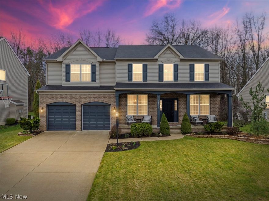 Stunning Colonial located in the highly desirable Braemore Subdivision. This 1-owner, quality-built Drees home, is move in ready! The carpet has been replaced on the 1st & 2nd floor (2022). Hot water tank (2022).  Living room and dining room are freshly painted (2026). Inviting 2-story foyer opens to the living room & dining room, featuring beautiful decorative columns & hardwood floors that flow into the kitchen. The kitchen is the heart of the house, open to the great room & featuring ample maple cabinetry, granite countertops, tile backsplash, a walk-in pantry, stainless steel appliances, a large island w/breakfast bar & a spacious dinette area with lovely views of the back yard. Grand, 2-story great room features a beautifully framed, gas fireplace & an abundance of windows that floods the space with natural light. Convenient 1st floor laundry & mud room with tile flooring + a half bath complete the 1st floor. Upstairs is the huge primary suite with vaulted ceilings and the en-suite bathroom, featuring tile flooring, double vanity sink, a soaking tub, a shower, a toilet closet and a large walk-in closet. 3 nice sized bedrooms & a 2nd full bath complete the 2nd floor. The basement is partially finished, offering a half bath, an open Rec Room space with a living area, a bar area, a gaming area + a gym area, while still allowing for a large, unfinished storage room.  Situated on a premium lot that backs up to the woods! The back yard is your own private oasis, fully fenced in, with a large, stamped, concrete patio & an above ground pool, wall & liner replaced 2025. The perfect place to relax or entertain. 3-car tandem garage! Sprinkler system in front yard.  Fantastic N. Ridgeville Location!! Quick Access to I-480 & I-80, Angelina's Pizza & Butternut Corners Market convenience store + other great amenities: Aut-O-Rama Twin Drive in Theatre, Hop Brothers brewery & other restaurants/shops. Truly a great value! See virtual 3d tour & schedule your private tour today!