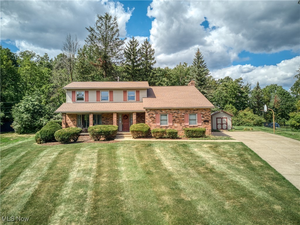 Charming Two-Story Colonial in Desirable Neighborhood!
This spacious 4-bedroom, 2.5-bathroom home is the perfect blend of classic charm and modern potential. Step into the welcoming foyer that opens to a formal living room with bayed window, a large dining room, and a cozy family room featuring a wood-burning full wall fireplace. Sliding doors open to the backyard, making it ideal for indoor-outdoor enjoyment. The kitchen offers a fantastic opportunity for you to make it your own, newer appliances included. Let your imagination run wild! Just off the kitchen, the eating area provides a casual spot to enjoy meals and family time. The ever desirable first-floor laundry, with washer and dryer, also includes cabinetry, a broom closet and easy garage access. The tiled foyer has a large coat closet and leads to the conveniently located guest bath. The 2nd floor consists of four bedrooms and 2 full baths. The huge primary suite boasts a vaulted ceiling, its own wood-burning fireplace, a full wall walk-in closet, and an en suite bath featuring double vanities, a walk-in shower, and a large linen closet. Siding glass doors lead to a nice balcony overlooking the backyard for your peaceful enjoyment. The additional bedrooms are spacious and bright, offering ample lighted closets. The home features a newer roof and gutters (2021), new sump pump with battery back up, and a full basement with tons of storage potential, and newer furnace (2021). Outside, the property sits high on a lot with a brick front porch, manicured lawn, mature trees, and a generous backyard. The oversized two-car garage offers plenty of room for your vehicles and additional storage. The long, wide concrete driveway allows for ample parking. Enjoy the peace and privacy of a quiet dead-end street, yet minutes away to everything. Ideally located close to expressways (82 and 77), major shopping, metro parks, and restaurants. Don’t miss the opportunity to make this house your dream home!