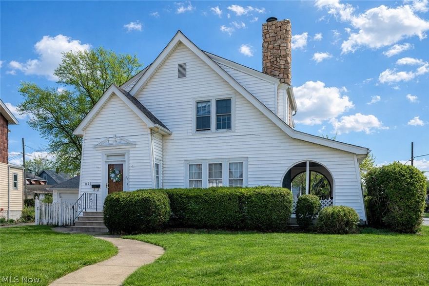 Fall in love with this charming white Colonial perfectly situated on a sunny corner lot just moments from the lake. Filled with natural light, this home offers a cozy, cottage-like feel and timeless character throughout.

The beautifully remodeled first floor features an open-concept layout ideal for everyday living and entertaining, complete with a stylish kitchen, granite countertops, and all appliances included. Gleaming hardwood floors run through the living and dining rooms, where a stunning picture window fills the space with sunlight and a fireplace adds warmth and charm.

Upstairs, you’ll find three inviting bedrooms with hardwood floors and a full bath, while the main level offers a convenient half bath. Enjoy your morning coffee or unwind in the enclosed porch, offering a comfortable space to relax year-round, along with the added benefit of a one-car garage.

Full of charm, light, and comfort, this home is perfectly located near the lake and ready to welcome its next owner.