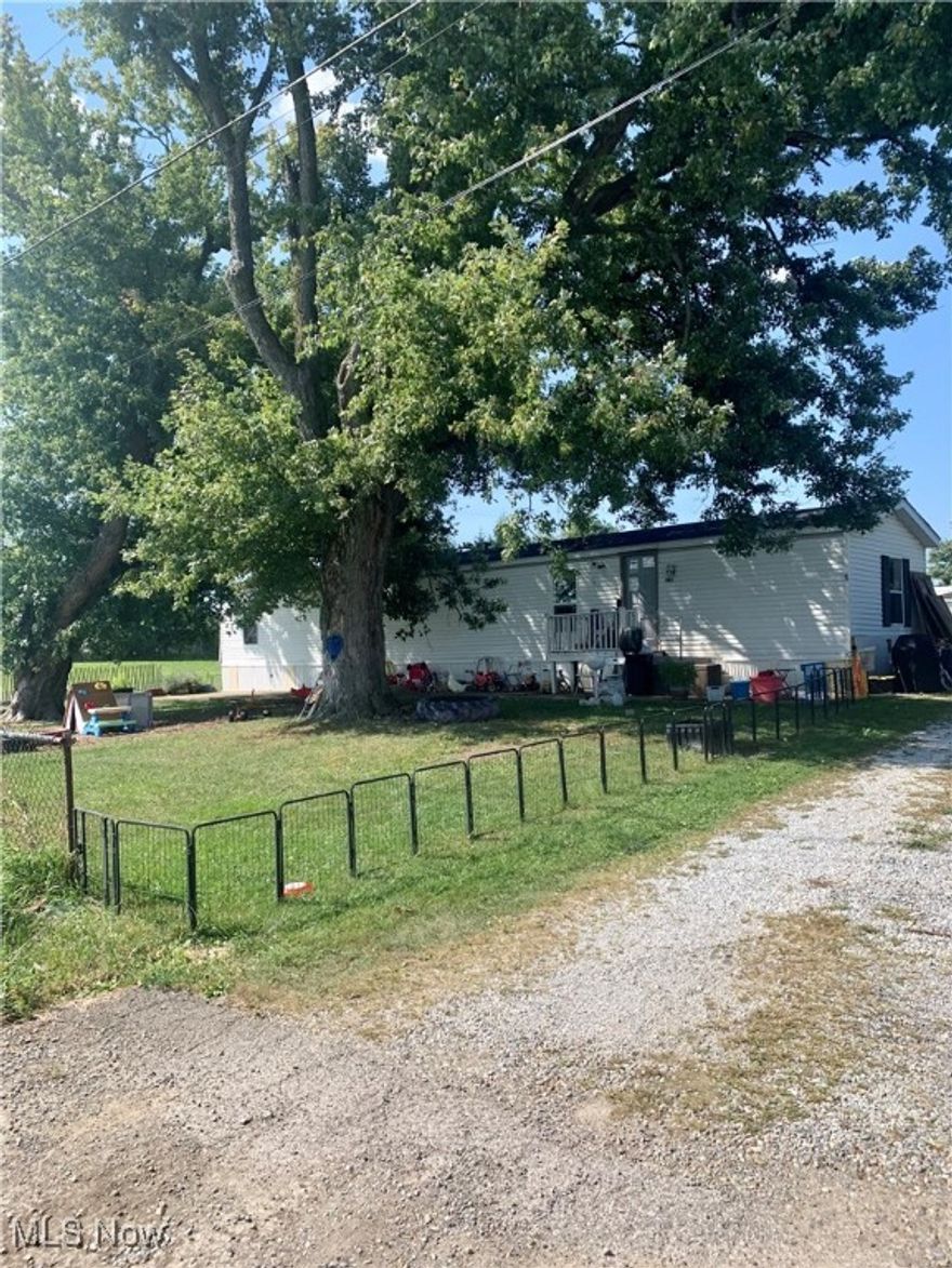 Cash Flowing Opportunity with long term tenants! This trailer park consists of 4 mobile homes and one single family residence. Annual Gross Income is currently just over $38,000. Owner pays trash. Mobile home titles to transfer at closing. Within the last year many updates have been completed! Great way to start or continue investing - Schedule your showing today!