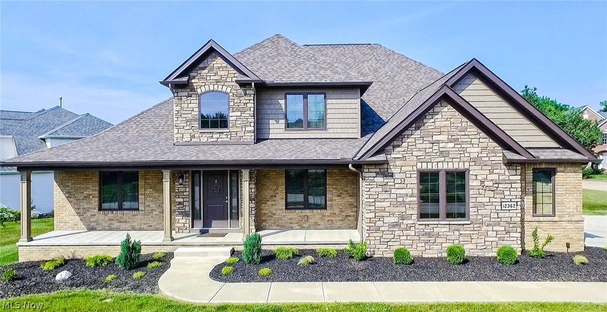 Nearly brand new stunning custom built Cape Cod home located in highly desirable Westwood Farms, one of Strongsville's most sought after communities. Impressive entry showcased by the two story foyer with beautiful wood and rod iron custom staircase, flanked by the formal dining room and study. Dramatic 2-story ceiling continues into great room, with soaring floor to ceiling stone fireplace. Modern distressed hardwood flooring throughout nearly the entire first floor is sure to impress. Large gourmet kitchen offers beautiful granite counter-tops, large center island and custom mosaic tile back-splash. Enjoy tea time in the morning room or enjoy the sun on the "trex" deck overlooking the private backyard. Favorable first floor master bedroom retreat with vaulted ceilings, luxury en suite with custom shower, granite double sink, garden tub w marble tile and massive walk-in closet. First floor laundry room, adjacent mud room, and guest bath complete the main floor. Upper level features 3