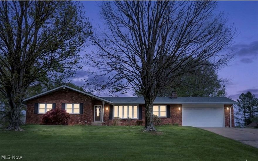Hard to find well maintained brick ranch home with new roof on .93 acres outside city limits! You'll love this 3 bedroom, 2 bath home, big 2 car garage and huge detached 16X30 Amish shed with water, electric and garage door. The beautiful landscaped curb appeal draws you to it with newer windows and front door. Walk into the welcoming foyer just off the living room with lots of natural light from bowed window and includes a coat closet.  Dining room has beautiful Hickory Shutler cabinets with Corian counter and pullout drawers, nice corner closet and a walk out to the deck. Open eat in kitchen with Shutler Hickory cabinets pull out deep drawers, Corian countertop and backsplash, gas range, refrigerator, microwave and dishwasher. The bathrooms have Cherry Shutler cabinets. Family room with brick wood-burning fireplace, gas hook up. The lower level has a carpeted finished 25x24 finished rec room with a brick fireplace with wood burner plus a large unfinished area for weights storage or play.  Laundry area with new washer, dryer and sink. For outside entertaining, there's a nice covered 16 x 36 deck with uncovered area for sun, with skylights and fan. Huge backyard! This home definitely deserves a tour so book your private showing today! Home Warranty.