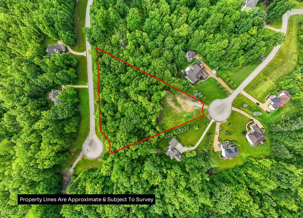 Discover your private retreat on nearly 3 acres of beautiful, wooded land—ready for your dream home. Nestled at the end of a quiet cul-de-sac, this serene property offers a picturesque setting with mature trees, natural privacy, and a gentle stream that winds through the landscape, adding to its charm and tranquility. Whether you're looking to build now or invest for the future, this lot provides the perfect blend of seclusion and opportunity. Utilities available at the street. Don’t miss your chance to own this peaceful slice of nature. Improvements to the property: Construction Driveway, Building Pad were completed, Trees Cleared, Septic Plan Approved, Soil Tests completed, Topography map, City Water Tap in completed. Trees were also planted at the rear of the property for added privacy and Retaining Wall was installed in the front.