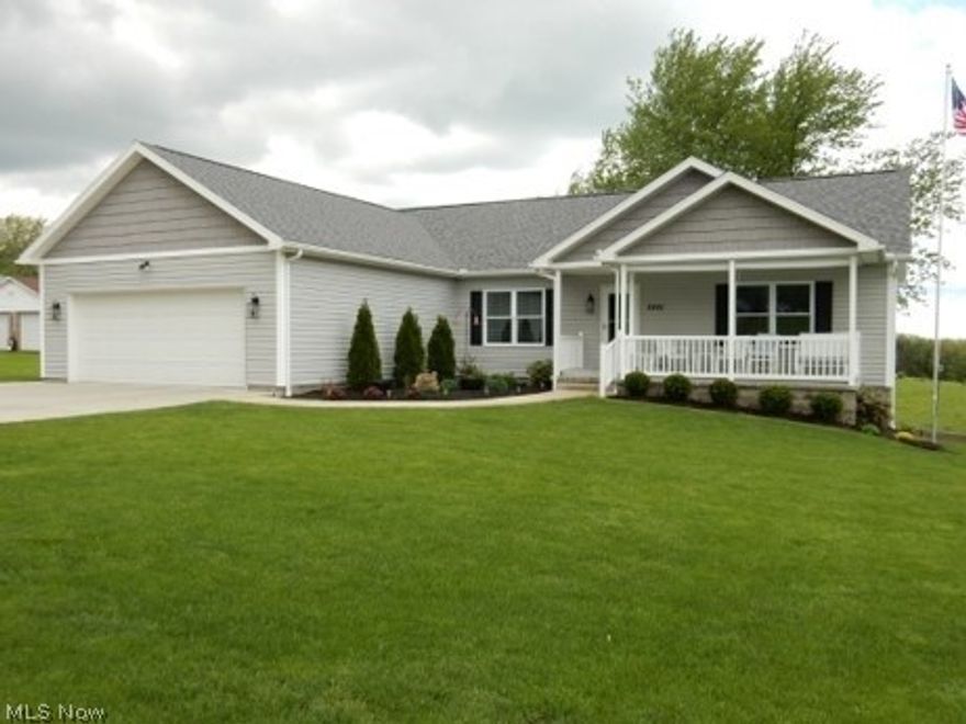 IMMACULATE HOME WITH OPEN FLOOR PLAN. Wide 36"doorways. Gorgeous kitchen boast all stainless steel appliances and is all open to dining and living room. Sliding door to large deck. Covered porch on front. 24x24 garage walks right into the laundry room. Master bedroom suite has large bath with double sinks and walk in closet. Huge open basement that would take very little to finish. Kitchen and bath down there with appliances and large island on wheels. Walk out to back yard. Perfect for summer entertaining and gardening or canning.. Full bath in basement also. You won't be disappointed in this one. Has everything to offer. All blinds and cornice valances will stay.