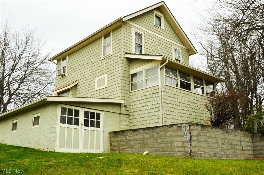 Cozy 3 Bedroom Colonial on a private .57 acre partially wooded lot in Barberton. Nice property for an investment includes appliances. One-car attached garage could serve as a Workshop or a Studio, enclosed front porch and a detached 2-car garage. Property consists of the following eight parcels: 0110377, 0110374, 0110375, 0103034, 6757920, 6757921, 6757922 and 6757923