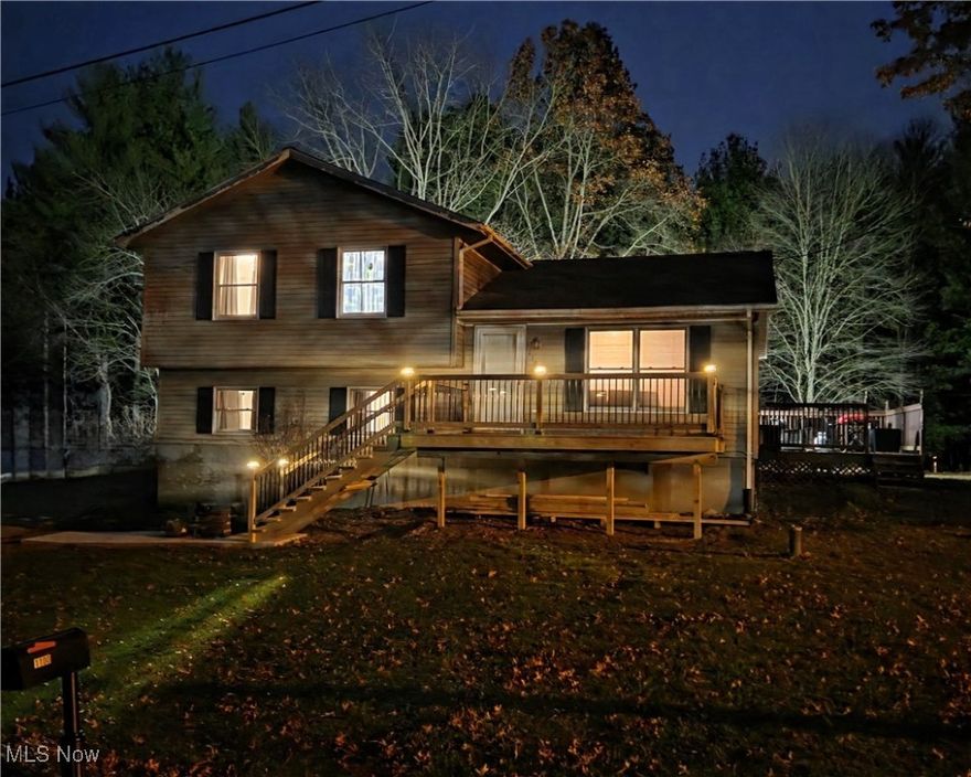 Move to the lake and Live Abundantly! This beautiful home is bigger than it looks! Entering the main floor you'll find a spacious Eat-in Kitchen and sizeable Living Room. On the second floor are three Bedrooms and a Full Bath. Heading down to the Lower Level you'll first come to the Master Bedroom. Originally a Family Room, this space has been converted to a Master Suite w/ a sliding barn door, a closet, a recently updated Full Bath, and a very large Laundry Room/ Master Closet. This Laundry Room could very easily be converted to a 5th Bedroom by relocating the laundry hookups. Moving down to the Basement level there is a Rec Room, the utility/mechanicals room, and a Home Office that could provide additional storage, or other options. The privately owned lot on which this home sits includes a storage shed, and two decks. The new front deck & sidewalk were completed just weeks ago. The back deck overlooks a level yard which sits along MWCD lakefront property, offering a shady, tree lined view of the lake without a land lease. It's a lovely view and makes the lot feel much larger than its actual size of just under 1/4 acre. Being a mere 2-minute drive from Atwood Marina East with the Sail N Power Grill, a 7-minute drive from Atwood Yacht Club, and 15-minute drive from Marina West with Lighthouse Bistro means convenient boating and dining options. In addition, it's approximately 1.5 hours to Cleveland or Pittsburg, and only 2 hours to Columbus! Updates include fresh paint in most spaces, Basement sealed & finished, new Dishwasher, and line from propane tank to house replaced 2025; well water bladder, water heater, most water lines & electrical replaced 2024; 2nd Floor tub/shower & water lines replaced, and Coaxial cable changed to fiber optic from pole though house in 2022. Don't delay: Make this amazing property your vacation OR year-round home and be ready for the spring boating season! Audio & Video recording devices in use in the interior and exterior of this home.