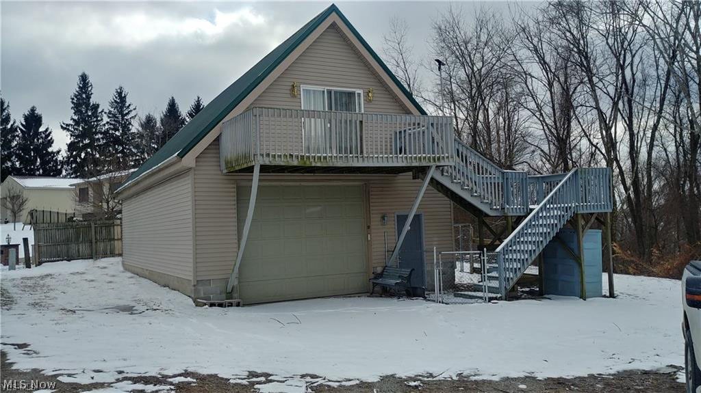 COUNTRY LIVING AT ITS BEST! Adorable, well thought out planning make this unique, A frame retreat a MUST SEE! Wooded, private lot with plenty of storage including a 12x16 shed, 4 car (1000sq ft) integral, tandem garage and huge outdoor storage chest are only a start to what makes this home so impressive. Beautiful 22x14 open living room/kitchen with updated..ABSOLUTELY EVERYTHING!! leading out to a large deck with gorgeous hilltop views. Extra wide hallway that would work great with a desk for office space or shelving for extra storage. Whole house has been freshly painted with added extras such as the beautiful ceiling fan in the living room and bedroom, newer carpeting and vinyl flooring. Couch stays too! Water filtration system, 1 year old washer and dryer boasting a conveniently located laundry area downstairs in garage. Pedestals do not stay with home. Extra loft space for storage help save a lot of floor space in garage! Per seller, structure size is 42x24 downstairs, 16x42 upsta