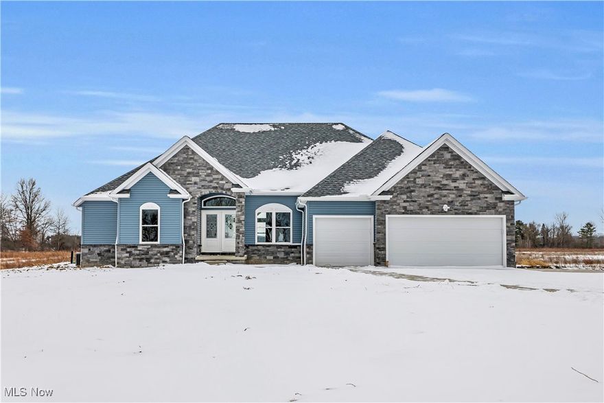 Be the first to call this brand-new 4-bedroom ranch home in Valley City your own. Built by Mason Builders and nearing completion, this 2,375 sq ft modern ranch sits on a peaceful 2.1-acre lot in scenic Medina County—ready for a quick move-in and designed for today’s lifestyle.

Step inside the open-concept Great Room featuring a striking stone fireplace and picture windows framing wooded backyard views. The kitchen impresses with granite countertops, a spacious island bar, breakfast area, and extensive cabinetry that blends functionality with modern style.

The flexible fourth bedroom offers the perfect space for a home office or study. The owner’s suite is a private retreat with a large walk-in shower, dual vanities, and generous closets. Two additional bedrooms share a convenient Jack-and-Jill bath.

A full basement—already plumbed for a future bath—invites endless possibilities for expansion or recreation. The oversized 3-car garage provides ample storage and workspace for hobbies or equipment.

Located in the desirable Buckeye School District, this new build combines peaceful country living with quick access to Valley City shops, parks, and major routes.

Construction is wrapping up soon—move in and start fresh in your new home at 7662 Springfield Drive, Valley City.