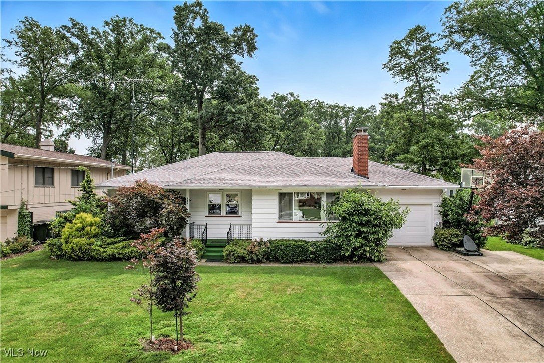 Fall in love with this pristine 3-bedroom, 2-bath ranch tucked into a quiet NE Warren neighborhood. As you arrive, you're greeted by a charming front porch and a single-lane driveway with an extended pad for extra parking. Inside, a bright family room with a picture window flows right into the cozy eat-in kitchen. Just down the hall, you will find three spacious bedrooms and a full bath. Head downstairs to a full basement featuring a family room with a bar, full bath, laundry area and loads of storage. The fenced-in backyard is your own little oasis, complete with a relaxing patio and a variety of lush grapevines that offer a sweet harvest every fall. This house is packed with updates, just look at the list: 2020-electrical box, soft-close kitchen cabinets 2022- windows throughout the house, garage door, hot water tank, upstairs and downstairs bathroom updated, painted inside, 2023- house painted outside, carpet throughout 2024- AC, furnace. Homes like this don't last long-schedule your showing today!!!!