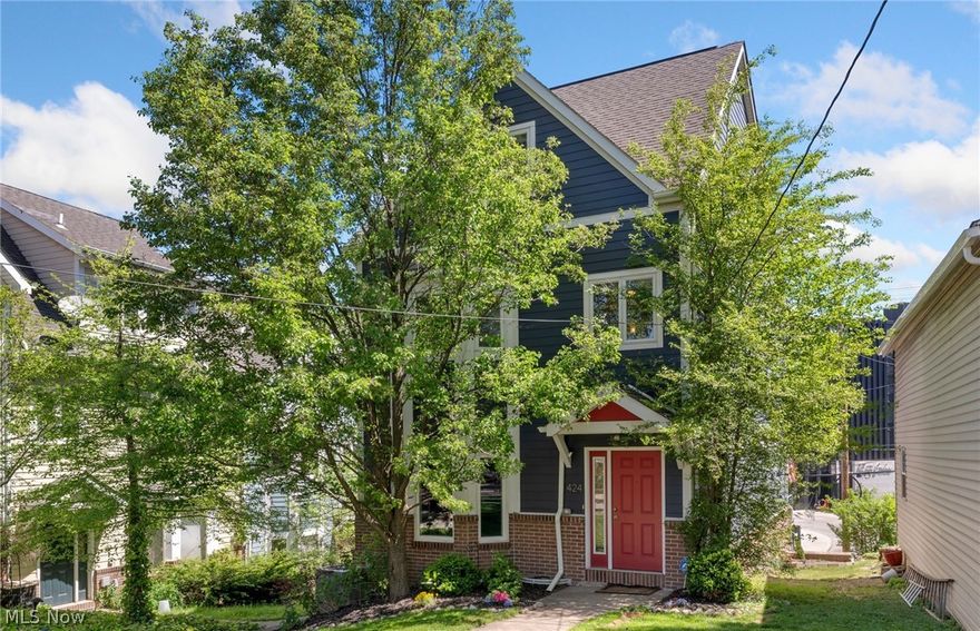 Nestled in the heart of one of Tremont's most sought after blocks, 424 Literary is a rare find! Steps away from the towpath trail, views of downtown, and all Tremont has to offer. Exceptional layout throughout really separates itself from the other homes in the area. Dramatic great room featuring beautiful hardwood floors, fireplace, tons of natural light, and access to a large terrace with amazing views. Tastefully renovated kitchen consisting of custom cherry cabinets, stainless appliances granite counters, and large breakfast bar/peninsula, leading you into the formal dining area. This is truly an open first floor concept. Sizable first floor half bath! Rare to find natural hardwoods throughout the stairwells, hallways, master bedroom and mega bonus space on 3rd! The second floor is highlighted by the enormous master suite consisting of your own private terrace, remodeled master bath, big walk in closet, and second fireplace. Second full bedroom and Full bath. The real stunner is the third floor space. Be amazed by the soaring vaulted ceilings, third fireplace, wet bar and great views of the industrial valley!  Used as the third bedroom now, this space could be a great office, kids room, workout area, bring your ideas... Additional lower level / basement space is perfect for home gym or can be finished for even MORE living space! Attached 2 car garage with access off Literary.  Do not miss out on this one! Schedule your private showing today!