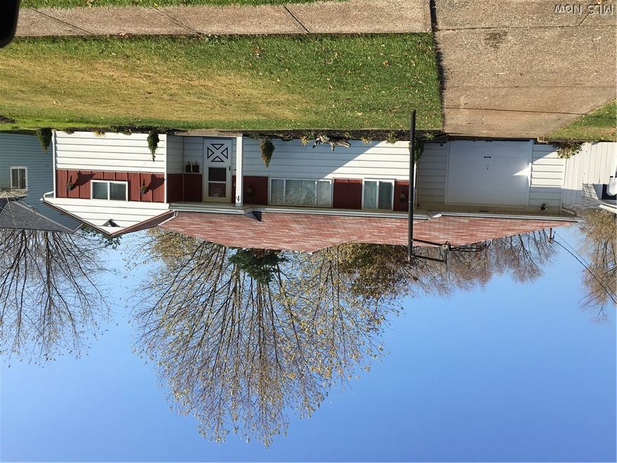 Clean and ready for owners!  Fresh paint, new carpet and kitchen vinyl.  All appliances including washer and dryer stay with home.  Garage converted into a family room with front 7 feet of garage used as storage space.  Covered patio and large shed in back yard.