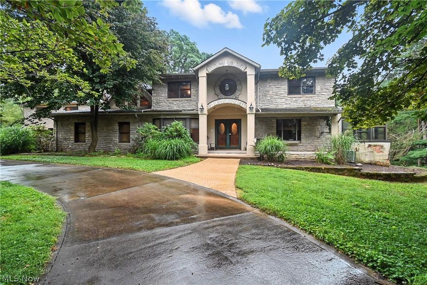 Lifestyle change forces motivated owner to part with this remarkable retreat just minutes from Snow Trails and I-71. Set on 8 scenic acres, this unique 5-bedroom, 3.5-bath home offers over 5,000 sqft of beautifully remodeled living space. The entire home was thoughtfully renovated in the early 2000s, featuring extensive custom woodwork and a great room that is unmatched in scale and character. Two expansive primary suites offer flexibility, including a luxurious 22x44 wing perfect for extended stays or multigenerational living. Entertain in the sunroom, full bar area, or walk-out lower level that opens to a stunning inground pool surrounded by nature. A large deck and gazebo offer space to relax, while the 24x42 pole barn and 8-car garage provide storage for vehicles, hobbies, or equipment. Natural gas heating, a whole-house generator, and two new central air units added in 2025 bring peace of mind. This property blends comfort, space, and lifestyle in a private, picturesque setting.