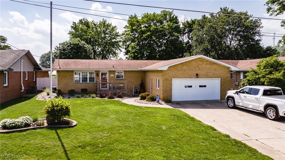 Wonderful perfectly maintained brick ranch located on a quiet Belpre Street. You will get that warm warm cozy at home feeling as soon as you walk in. The home's charm comes from the beautiful wood floors complimented by the kitchen and dining room amazing oak hand crafted custom made cabinets....they are outstanding. There are many updates that, include, newer furnace and AC in 2019, new Kinetico water softener 2020, extra attic insulation 2013, new gutters with leaf guard, hot water tank 2015, new garage door opener and springs, 2017 hardwood floors refinished, screened in porch with electric, 2016. landscaping 2021-2022. storage barn & porch electric updated. The screened in porch will be your place for morning coffee and a book or cup of tea before bed. Pet lovers will enjoy the flat fenced in back yard. The front porch features maintenance and worry free lifetime decking. Wait there is more for the basement features a wall to wall desk and work station, perfect for working at home