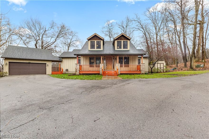 Escape to your own private retreat with this stunning home nestled on over 5 acres in a serene, rustic setting. Located in Poland LSD, this home offers breathtaking views from every window, overlooking wooded hillsides and providing the perfect blend of seclusion and convenience. Step inside and discover an interior that effortlessly blends style with comfort. Floor-to-ceiling windows flood the open floor plan with natural light, offering picturesque views. Bamboo floors add warmth and elegance to the living room, which features a fireplace and a cathedral ceiling. The kitchen boasts granite countertops, a breakfast bar, cathedral ceiling, and sliding glass doors leading out to a deck, perfect for enjoying meals outdoors. The formal dining area is ideal for entertaining guests, while the first-floor owners suite provides a tranquil retreat with its vaulted ceiling, a 9x7 walk-in closet, and a bathroom featuring a jetted tub, double sinks, and a step-in shower with dual shower heads. The first-floor laundry room and stylish half bath on the first floor add convenience. The second floor features a loft and two bedrooms, each with their own full bathroom. The lower level walks out to a deck, overlooking the ravine with a bubbling brook below, providing a peaceful and picturesque setting. This level features a family room, complete with a kitchenette, making it perfect for entertaining or use as an in-law suite. Additionally, there is a 4th bedroom and a full bath, offering plenty of space and versatility for your needs. 2 car garage. With its scenic surroundings and convenient location close to shopping, this home offers the perfect combination of tranquility & accessibility. For your peace of mind, the home has been pre-inspected, and a 1-year Americas Preferred Home Warranty is included. Enjoy the solitude and breathtaking views this property has to offer. Opportunities like this are rare, so don't miss out.