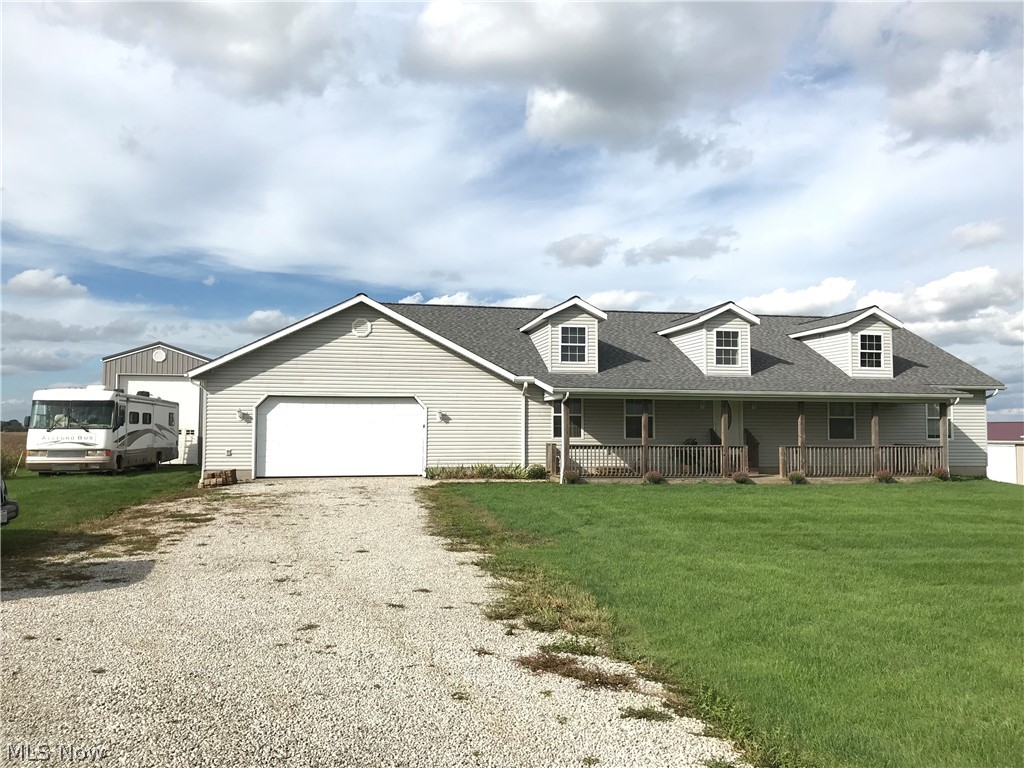 Excellent opportunity to purchase a beautiful custom home in the country with many amenities. On 1.62 acres in Wayne county north of Apple Creek this home was built in 2006 and features 2670 S.F. of living space on the main floor. The spacious floor plan features 4 bedrooms, and 3 full bathrooms including 2 master bedrooms with walk-in closets, one bathroom features a jacuzzi tub as well as large walk-in shower. The home offers your chefs dream kitchen featuring solid red-oak cabinets with built-in pantry, dining room, great room and laundry all on the main floor. There is a full unfinished walkout basement with the option of 2 additional bedrooms that are currently unfinished, storage room and an area that is setup as a hobby woodworking shop. The utilities to the property are private well and septic, forced air electric/propane furnace, central air and electric hot water heat. There is a 2 car attached garage as well as a detached 16' x 40' with 16’ ceiling motor home garage with ele