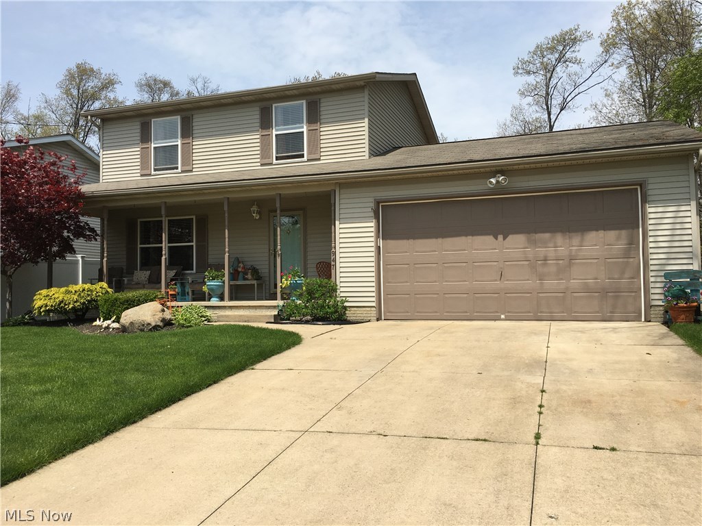 This exceptional 3 bedroom, 1.5 bath home located on a private Cul-de-sac has been well-maintained through the years with much attention to detail. Easy-care real oak hardwood flooring on the first floor and the newly-remodeled, stunning kitchen offers additional granite counter space makes family living and entertaining a joy. The gas-start fireplace can be viewed from living and dining rooms located in the sunroom addition which opens to a private backyard 14x12 wood deck, 12x22 brick patio, and large backyard for many activities. Not-to-forget the relaxing 25x6 covered front porch, insulation, and central air. You will appreciate the cleanliness, fresh baths, nice size closets and good storage throughout. Attached 2-car garage 28x22 complete with 8 ft high entry door, added organized storage cabinets, water, and service door that conveniently enters the backyard. Poured 12-course basement ready to finish your way already plumbed for another bathroom (new tub, surround, vanity s