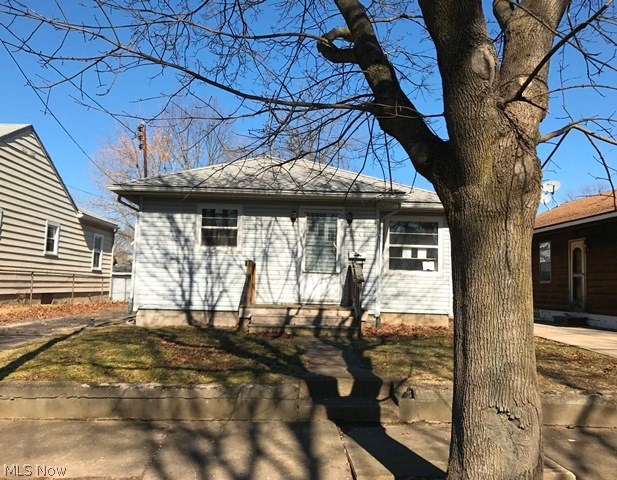 Cute 2 bed/1 bath ranch with almost 850 square feet of living space. It features a rustic kitchen with a window, wood flooring, a basement, and a detached 1 car garage.