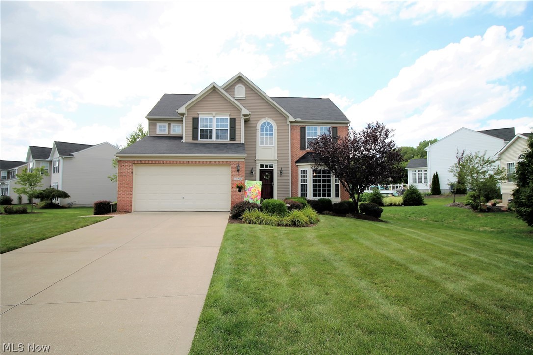 Welcome home to this stunning four bedroom, two and half bath colonial home that sits on a gorgeous wooded .403 lot. Come on in from the newly landscaped front yard to an open floor plan offering a large, bright family room with gas fireplace, dining room with large bay windows and crown moldings, eat in kitchen area. The kitchen is a chef's delight offering large island, abundance of cabinets and counterspace, backsplash with recessed lights, double oven and all stainless steel appliances. There is a morning room off of the kitchen with abundance of large windows to let the natural light to shine through and a door that leads to the gorgeous stamped concrete patio for entertaining or just enjoying. A half bath and fabulous laundry room with wash tub finishes the main level. Upstairs you will find the large master suite with sitting area, walk in closet, full master bathroom with garden tub. Also there are three large bedrooms, and a full bathroom to finish the upstairs. The completel
