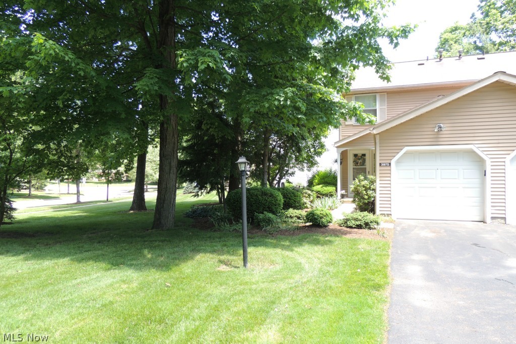 Don't miss this beauty! End condo with big side yard. Updated condo with solid cherry flooring throughout first floor. Freshly painted throughout! Kitchen cabinets freshly painted with new hardware and brand new counter tops! Some updates include newer light fixtures, newer hardware, newer shower head. Spacious great room with gas brick fireplace, perfect for those cold nights . Eating area and breakfast bar. All appliances stay including washer and dryer. 1/2 bath on first floor. Big Rec room in finished basement with 1/2 bath . Extra large Master bedroom with sitting area. Second bedroom is also large and lots of closet space. Privacy fenced back yard with nice patio just perfect for relaxing. Updated sliding door from great room to patio. Radon system installed in basement. 1 car attached garage. Move right in. Close to shopping and Graham Rd. This is a PUD development and can do FHA/VA loans. Monthly fee is $115 which includes snow and trash removal. Move right in!