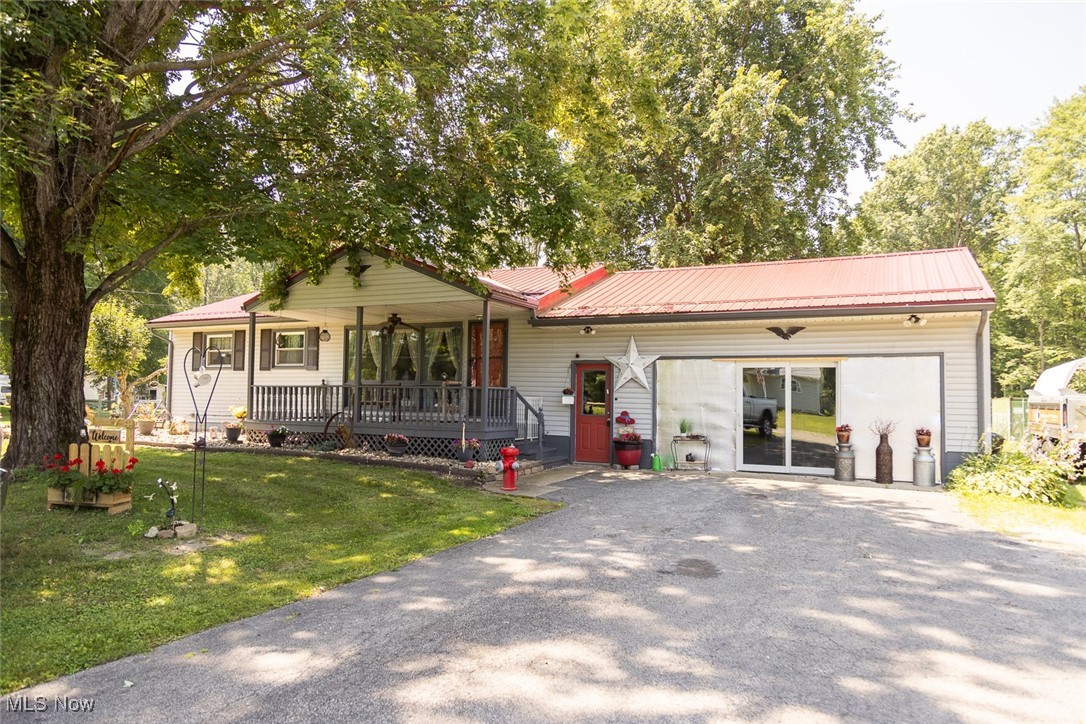 Step inside this immaculate Ranch farm house with 5 acres in Bristol! The large kitchen has hardwood flooring throughout, wooden cabinetry, wooden charcoal countertops, with a copper backsplash. The cozy living room has hardwood flooring and beautiful large windows that look out into the front porch. The full bath has tile flooring with a stone and copper vanity. The bedrooms have hardwood flooring throughout. The first floor laundry could be converted into a 3rd bedroom, or kept as a laundry room for convenience. The large, heated garage was converted into an extra living room / hang out space, but could easily be converted back into a garage. Outside you will see a serene back patio hang out area that leads to multiple gardens and acres of farm land with an outbuilding and horse trailer to use as needed. The furnace was put in new in 2024, new AC in 2024, and new roof in 2023.