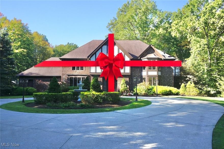 Your Chance to Own “The Grand Dame of Chartley Road” — a timeless Tudor estate that defines elegance, comfort, and grand entertaining. Designed for those who love to host and live beautifully, this stunning 9,300+ sq. ft. residence combines classic craftsmanship with resort-style luxury. Step inside and experience the warmth of spacious living and family rooms, a sunlit Florida room, a formal dining room worthy of celebration dinners, and a gourmet kitchen built for culinary creativity — complete with double ovens, expansive prep areas, and an effortless flow for entertaining. Upstairs, five generous bedrooms and three full baths provide comfort and privacy, while the lower level invites endless fun with a game room, movie theater, exercise area, and full wet bar — the perfect retreat for guests and gatherings alike. Outdoors, your private oasis awaits: a 50' x 25' heated pool and pool house featuring showers, a full bath, kitchenette, wine refrigerator, and keg cooler. Enjoy your morning coffee or evening unwind in the jetted spa, surrounded by mature trees and over 2.5 acres of peaceful beauty. Solid brick construction ensures timeless appeal and low maintenance, while the circular drive and 4-car garage add both convenience and curb appeal. Just minutes from freeway access, this home offers the rare combination of privacy and accessibility. Luxury. Space. Lifestyle. “The Grand Dame of Chartley Road” is more than a home — it’s a statement. Tour this home and claim your own private resort.. Home has city water & sewer.