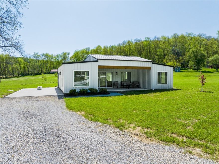 Onsite auction with online bidding begins ending Wednesday, June 18th at 6:00 PM. Set against the scenic backdrop of Holmes County’s countryside, this one-of-a-kind, newly built and eco-friendly home is situated on its own spacious 1.5-acre lot. Whether you're searching for a peaceful getaway, a short-term rental investment, or a full-time residence, this modern retreat checks all the boxes.

This home offers approximately 1,000 sq. ft. of thoughtfully designed living space with 2 bedrooms, 1 full bathroom, and an open-concept floor plan that welcomes in natural light through large windows. The bathroom features both a soaking tub and separate shower, while the kitchen comes fully equipped with electric appliances. All furnishings shown are included, making this property truly a turnkey opportunity.

Enjoy quiet mornings on the patio or evenings around the backyard firepit, with wide-open views and a calm, rural atmosphere. With enough space for a garden or small pasture for a few animals, this property provides the charm of country living with low-maintenance ease.

Efficient systems include mini-split heating and cooling, electric water heater, and all-electric kitchen. Purchase this home or another one like it that is listed next door and will be offer seperately or together in this exciting auction opportunity—perfect for investors, first-time buyers, downsizers, or those seeking a furnished countryside retreat. Address listed is not actual address. A new address will be assigned when the new survey is recorded.