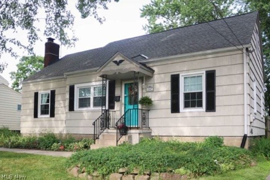 Dont miss this spacious and updated 4 bedroom home in Cuyahoga Falls!  This well cared for home boasts an open floor plan with a large living and dining room, a charming fireplace, 2 first floor bedrooms and a newly remodeled bathroom.  2 large bedrooms upstairs with exceptional closet  and storage space. Modern paint colors throughout, as well as gleaming refinished wood floors.  Great rec room area in basement.  Enjoy your fenced yard from your multi level back deck with a gas line for your grill.  So many updates!  Newer roof, windows, storm doors,  appliances, Trane furnace and a/c.  1 car garage and newer carport.  This one is truly move in ready, dont wait!