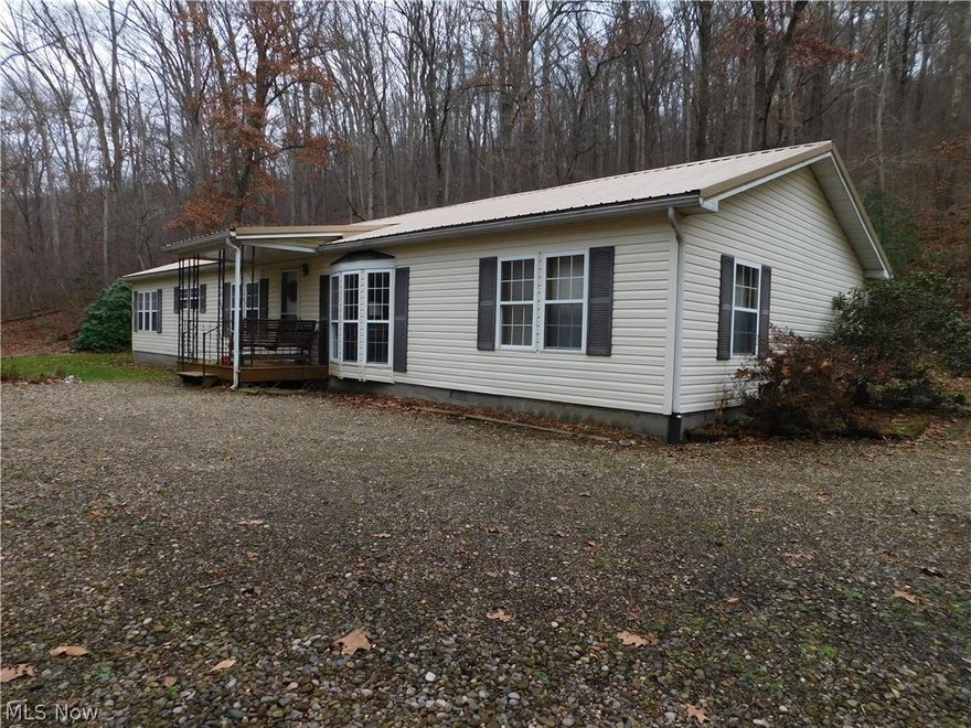 Seclusion. Affordable living. Wildlife haven. Built in 1992 this 1 owner home offers 3 bedrooms, 2 full baths, large kitchen,dining, laundry and family room with a woodburning fireplace. The home sits on a 7 course block crawl space and a new metal roof in 2006. It has a carport and tool shop. With the transfer of the property comes your very own gas well which supplies FREE GAS for the furnace, space heater, hot water tank, cook stove, and dryer. Property comes complete with spring fed creek, garden area and excellent hunting.