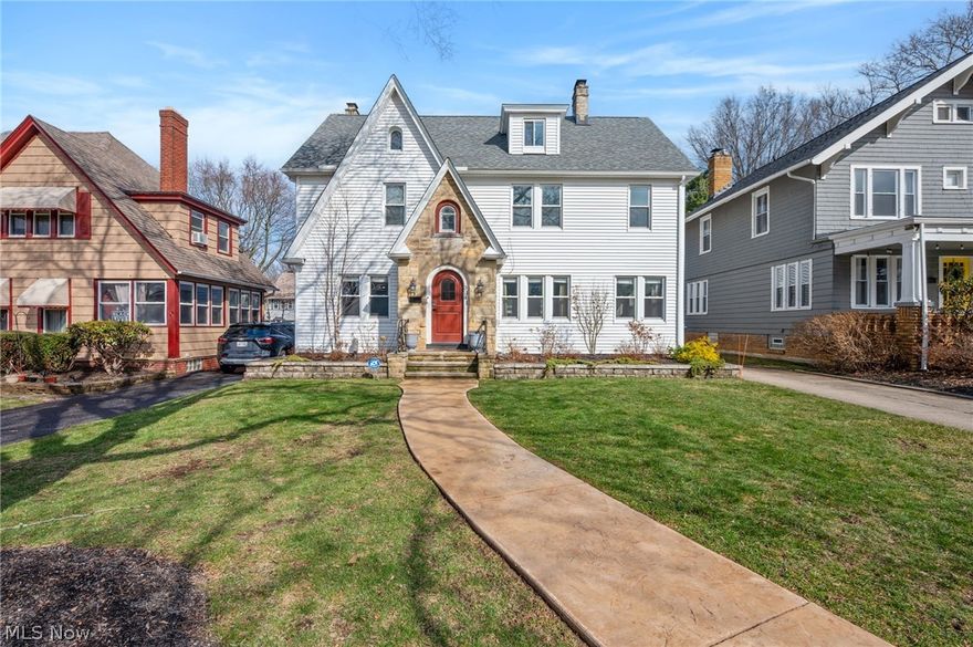 Welcome to 3141 Washington Blvd in the heart of Cleveland Heights, where timeless character meets thoughtful modern renovation in this beautifully updated center hall colonial. Pull up to the charming exterior and inviting red front door before stepping inside to sweeping refinished hardwood floors and a classic layout that perfectly balances historic charm with today’s lifestyle. The living room with a wood-burning fireplace offers a warm place to gather, while the spacious formal dining room is perfect for hosting large dinners and celebrations. At the center of the home is a stunning open kitchen featuring crisp white soft-close cabinetry, granite countertops, stainless steel appliances, and an oversized island with breakfast bar seating. Just off the living room you’ll find a bright sunroom and a versatile bonus space ideal for a home office or flex room. The second floor offers three spacious bedrooms including two ensuite bathrooms along with a beautifully finished hallway bathroom, plus the convenience of second-floor laundry. The third floor provides an impressive private suite perfect for a fourth bedroom, guest retreat, recreation space, or home theater with its own ensuite bathroom featuring a quartz vanity and tiled step-in shower. The lower level includes a rec room with durable Nature Stone flooring ideal for a home gym or playroom along with ample storage. Outside, enjoy a landscaped backyard with a patio and built-in wood fireplace plus an exceptionally rare three-car detached garage — a hard-to-find feature in Cleveland Heights that provides incredible space for parking, storage, or hobbies. Ideally located between the vibrant Coventry and Cedar Lee districts and just minutes from Cain Park, University Circle, Cleveland Clinic, UH, and Case Western Reserve. Welcome home to 3141 Washington Blvd.