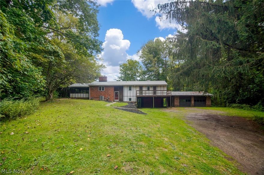 Nature lovers! Here's your chance to own a wooded retreat with 18.9 acres and a small lake that is well stocked with bass and blue gill. Secluded four bedroom home has a living room with vaulted ceiling and a woodburner.  20' X 16' screened in porch and deck. Walk out lower level has family room with woodburning fireplace. recently painted interior, newer roof and hot water heater.  Kenston School District.