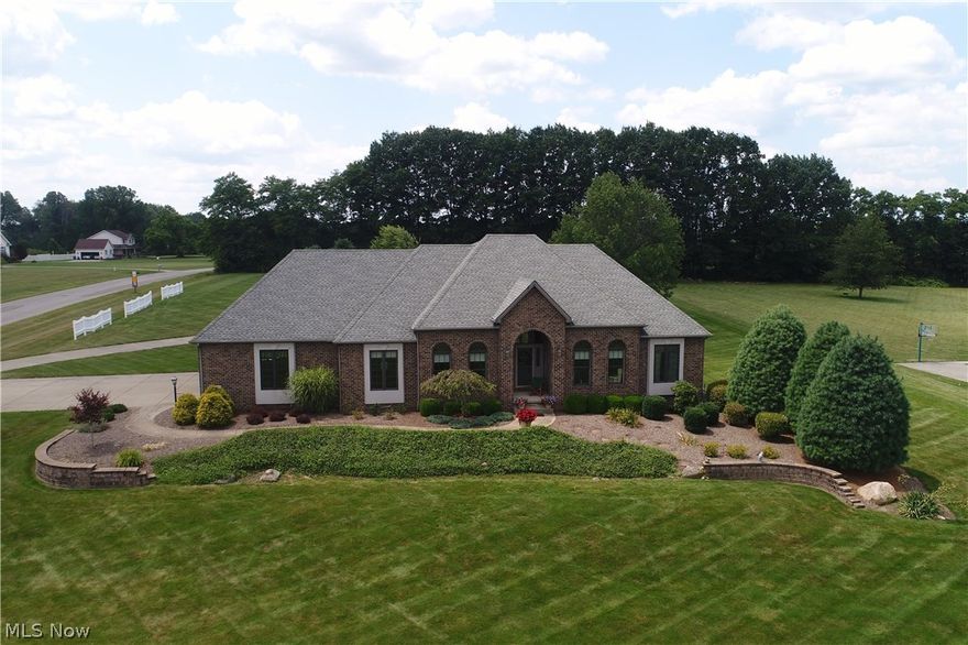 Custom built home situated on a prime 2+ acre corner lot in the Highlands development offers the
highest quality materials. Beginning with the Baird Brothers hardwood flooring, granite countertop,
hand selected tile and solid oak 6 panel doors and trim. As you enter the home you are greeted by the
warmth of perfectly selected colors, lovely formal dining area and office space. The kitchen has newly
installed granite and tile as well as a large pantry and stainless steel appliances. A sunroom located off
the kitchen allows you to enjoy the beautiful landscaping and private patio area. A lovely family room
flows seamlessly from the kitchen and offers a gas fireplace and vaulted ceiling. Enjoy the convenience
of first floor laundry. Master bedroom with new carpeting, tray ceiling and spacious walk in closet is
located on the main floor and offers a master bath with jacuzzi tub, dressing table and natural light.
Main floor also hosts 2 additional bedrooms and newly remodeled full