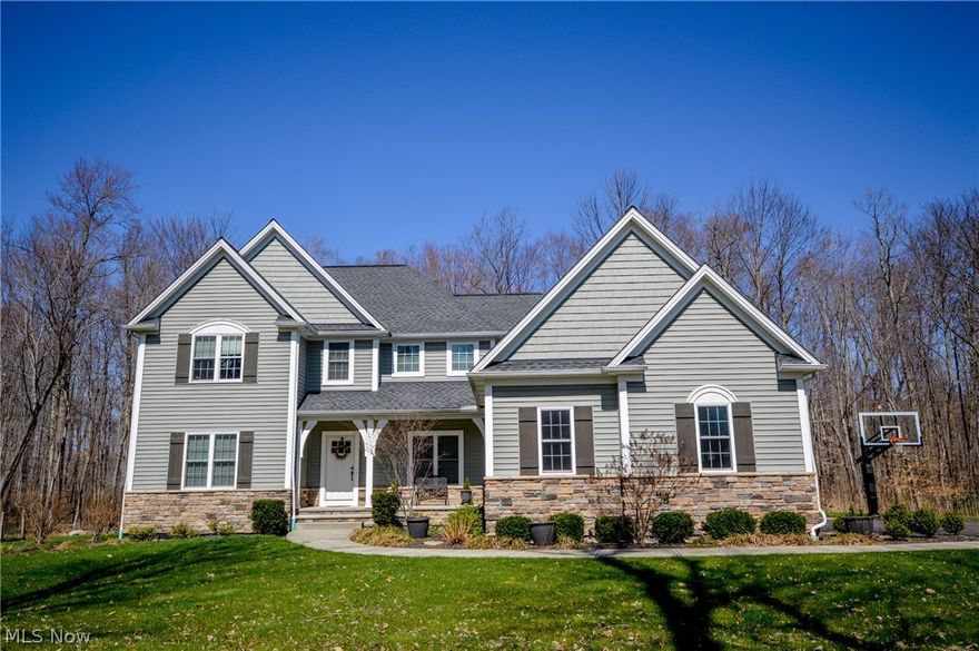 Beautiful 7 year old Bravo Constructed home on private 2 acres.  Builder upgrades throughout with current owner upgrades of another $30K.  Gourmet Kitchen boasts wood flooring, granite countertops, Kraftmaid cabinetry, island w/bar stools, double ovens, a generous sized pantry and an eat in dinette area.  Tray ceiling dining room.  Mudroom with builtin locker units and unique tile flooring.  Oversized first floor laundry room with plenty of cabinetry, granite countertops and a clothes chute from the second floor.  1st floor study/office.  Builtin Kraftmaid office off dinette area.  Vaulted open Great Room comes complete with a stone gas fireplace.  First floor master boasts a tray ceiling, double sinks w/granite tops, his & her walk in closets and beautiful tile shower.  Second floor master/teen suite is just as nice with another full walk in closet, spacious bathroom and an additional unfinished bonus room.  Two good sized bedrooms on second floor contain walk in closets and have open