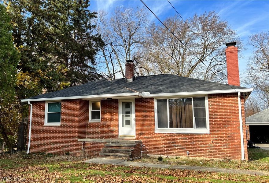 Home sweet home! This charming brick ranch is sitting on a beautiful park like lot near everything you need. Throughout the home is a fresh coat of paint and beautifully refinished hardwood floors capped off with new baseboards! In the basement you'll find a few sectioned off spaces including a full bathroom, workshop and space to build to suite. In the rear of the home is an adorable sun room then out to the oversized garage with a shop space addition on the rear. There are not many opportunities that come up in the area so act fast!