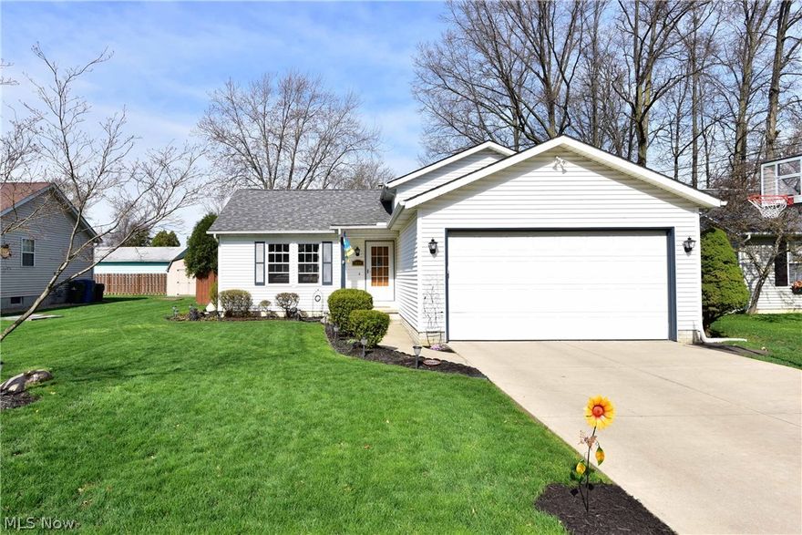 Welcome home !  Newer split level home located on a 60'x133 park-like lot.  Vaulted ceilings in living and dining rooms.  Dining room leads to a 15'x12' enclosed sunroom great for summer gatherings and entertaining. Second floor has 3 bedrooms and a full bath.  Master bedroom has vaulted ceilings and two closets.  Large lower-level family room with stone wood burning fireplace, full bath and utility room with additional crawl space storage.  Newer flooring, appliances and hot water tank just recently replaced.  Home has been impeccably maintained.  Great location close to schools, shopping, parks and so much more.  Nothing to do but move in and enjoy !  Schedule a showing today.