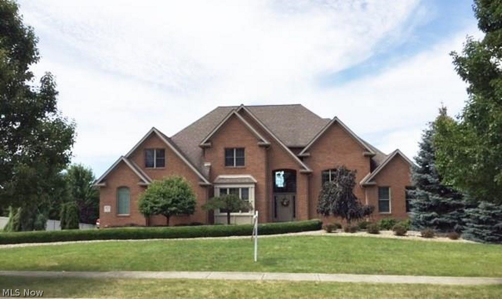Spectacular 4 bedroom, 4 1/2 bath home in prestigious Tuscany Estates. The brick & vinyl 2 Story home presents quality with 2 Story hardwood floors leading to the soaring Great room with cut stone fireplace. The office features cathedral ceiling and 8 ft. french doors for privacy. First floor master bedroom suite contains fantastic walk-in ceramic shower, Jacuzzi tub, his/hers walk-in closets with built in shelving. The must have first floor laundry has ceramic floors and built-in cabinetry. The kitchen boast ceramic floors coordinating with traditional upscale cabinets. The recently completed finished basement includes a family theater room, possible 5th bedroom, work bench room and mud room off separate garage entry. 3+ Car garage with extra high ceilings. This professionally landscaped home is located on a dead-end street and ready for immediate occupancy.